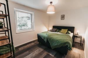 Ένα ή περισσότερα κρεβάτια σε δωμάτιο στο Seeblick Homes