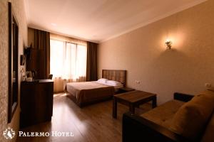 Voodi või voodid majutusasutuse Palermo Hotel toas