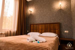 Voodi või voodid majutusasutuse Palermo Hotel toas