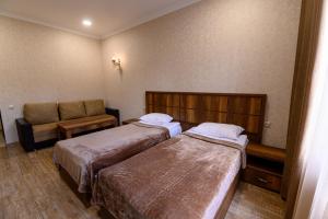 Voodi või voodid majutusasutuse Palermo Hotel toas