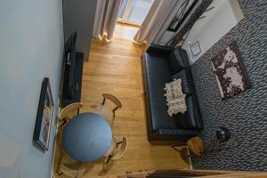 A television and/or entertainment centre at Main train station apartment close to the the Main Square!