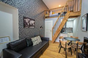 A seating area at Main train station apartment close to the the Main Square!