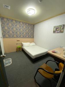 Postel nebo postele na pokoji v ubytování Rich Zone Hotel