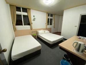 Postel nebo postele na pokoji v ubytování Rich Zone Hotel + 11 fotografií