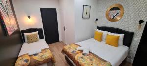 Posteľ alebo postele v izbe v ubytovaní 158 - Urban Louis Vuitton Flat in Montorgueil