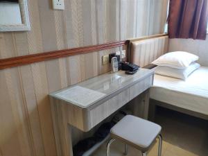 A bed or beds in a room at Celltronik Hostel 先創旅店