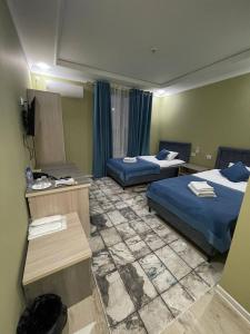 Ein Bett oder Betten in einem Zimmer der Unterkunft CITIZEN HOTEL