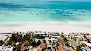 an aerial view of the beach at the resort at Aldea Kuká, Luxury Eco Boutique Hotel - Adults Only in Holbox Island