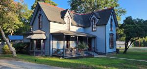 a large blue house with a black roof at The Carson House Bed & Breakfast in Pittsburg