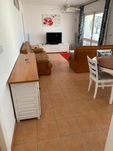 a living room with a couch and a table at Casa Estrella in Mojácar +10 photos