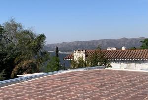 a tile roof with a view of the water at Casa de Ali in Villa Carlos Paz