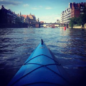 a view from the back of a kayak in the water at Gdansk Old Town 2 room Apartment in Gdańsk