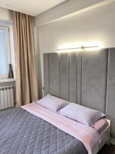 Postel nebo postele na pokoji v ubytování Apartment on KShT