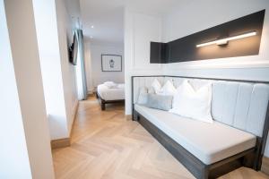 Säng eller sängar i ett rum på Hôtel Boutique Ophelia