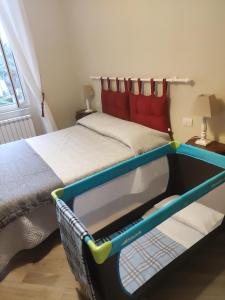 San Giacomo home tesisinde bir odada yatak veya yataklar