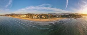 an aerial view of a beach with a resort at Hotel Miramar Playa America Nigran in Nigrán