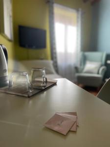 TV a/nebo společenská místnost v ubytování Le Camere di Bsuites Affittacamere