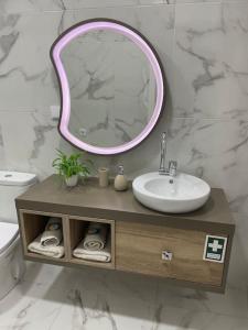 a bathroom with a sink and a mirror at Relax Sintra Home - Near Lisbon in Queluz