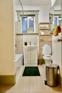 a small bathroom with a sink and a toilet at Private room in a Shared house in Vancouver