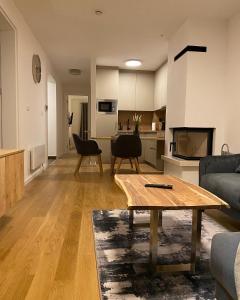 a living room with a couch and a table at MA Apartment Jahorina in Jahorina