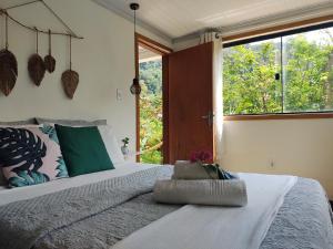 Postel nebo postele na pokoji v ubytování Suites casa do indio jungle, a melhor vista da floresta