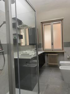 a bathroom with a glass shower and a toilet at Casa Nonna Lina in Sommariva del Bosco +24 photos