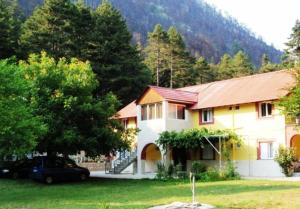 a house with a car parked in front of it at Amarantos in Loutra Amarantou