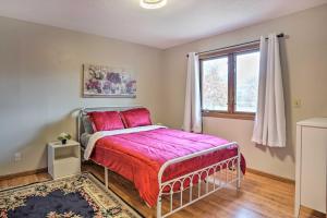 a bedroom with a bed and a window at Lovely Minneapolis Home Near Target Field! in Minneapolis