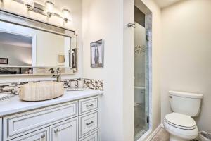 a bathroom with a toilet and a sink and a shower at Large Santa Fe Townhouse with Private Patio! in Santa Fe +22 photos