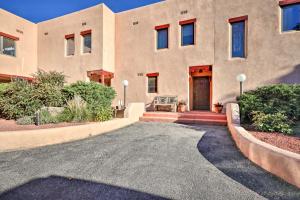 a house with a driveway in front of it at Large Santa Fe Townhouse with Private Patio! in Santa Fe