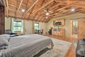 a bedroom with a bed and a living room at Cassopolis The Cabin Retreat Lake Access! in Cassopolis