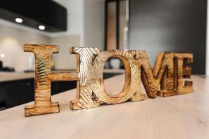 a wooden sign that says love on a table at Disneyland Dream 5 - Charmante Maison 10 pax in Chessy