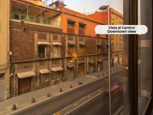 a view of a city street from a window at Mexico Historic Center Modern Apartment in Mexico City