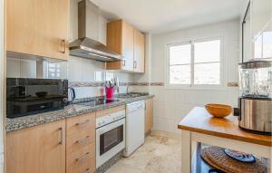A kitchen or kitchenette at Gorgeous Apartment In Benalmádena