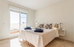 A bed or beds in a room at Gorgeous Apartment In Benalmádena