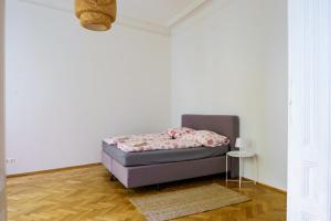 Postel nebo postele na pokoji v ubytování Vienna City Apartment University