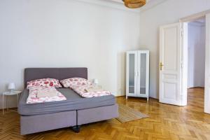 Postel nebo postele na pokoji v ubytování Vienna City Apartment University