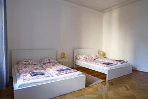 Postel nebo postele na pokoji v ubytování Vienna City Apartment University