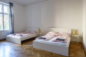 Postel nebo postele na pokoji v ubytování Vienna City Apartment University