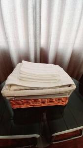 a stack of white towels sitting on a table at Gorgeous Private Studio LIMA-Own Bathroom-Near Airport in Lima
