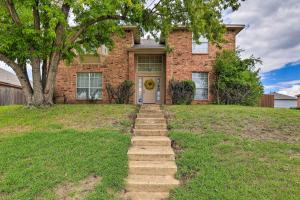 a brick house with stairs leading to the front door at Charming Family Home about 16 Mi to Dtwn Dallas! in Cedar Hill
