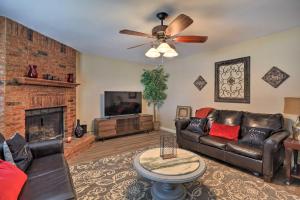 a living room with a couch and a fireplace at Charming Family Home about 16 Mi to Dtwn Dallas! in Cedar Hill