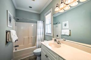 a bathroom with a sink and a shower and a toilet at 1 Mi to Beach and Hot Tub Murrells Inlet Retreat! in Myrtle Beach