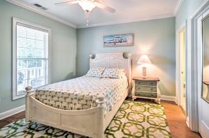 a bedroom with a bed and a window at 1 Mi to Beach and Hot Tub Murrells Inlet Retreat! in Myrtle Beach