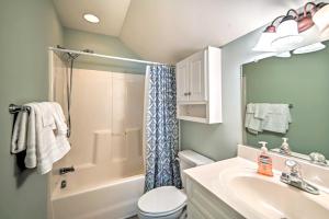 a bathroom with a shower toilet and a sink at 1 Mi to Beach and Hot Tub Murrells Inlet Retreat! in Myrtle Beach