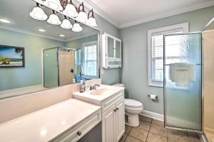 a bathroom with a sink and a shower and a toilet at 1 Mi to Beach and Hot Tub Murrells Inlet Retreat! in Myrtle Beach