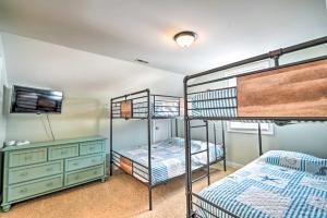 two bunk beds and a dresser in a room at 1 Mi to Beach and Hot Tub Murrells Inlet Retreat! in Myrtle Beach