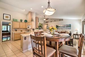a kitchen and dining room with a table and chairs at Reno Home with Private Yard and Hot Tub in Reno