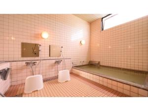 a bathroom with a tub and two white toilets at Hotel Tamano - Vacation STAY 41648v in Otawara
