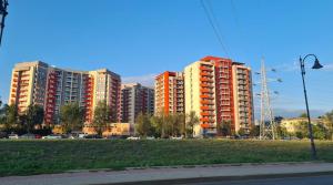 a group of tall apartment buildings in a city at Iulius Mall River Tower in Iaşi